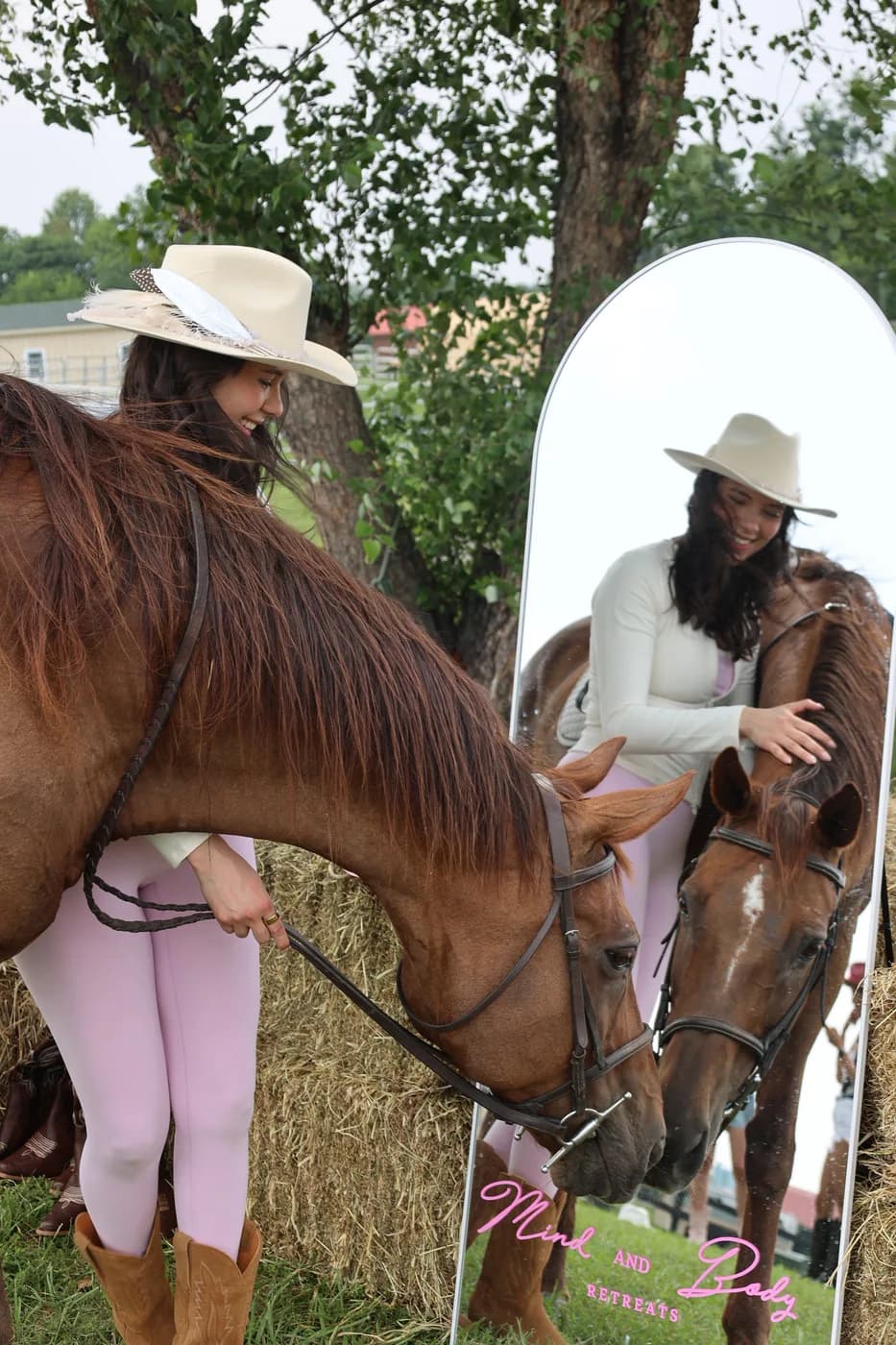 Guest and chestnut horse reflected in the styled Mind & Body Retreats mirror at the Horses & Pilates photo moment